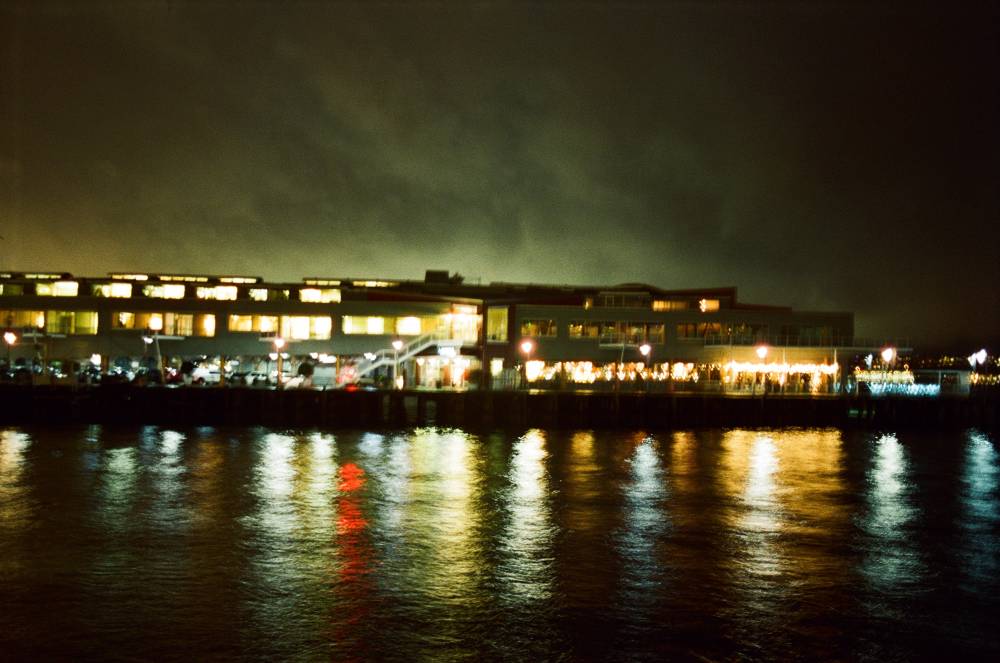 Lights reflect on the water like an impressionist painting 