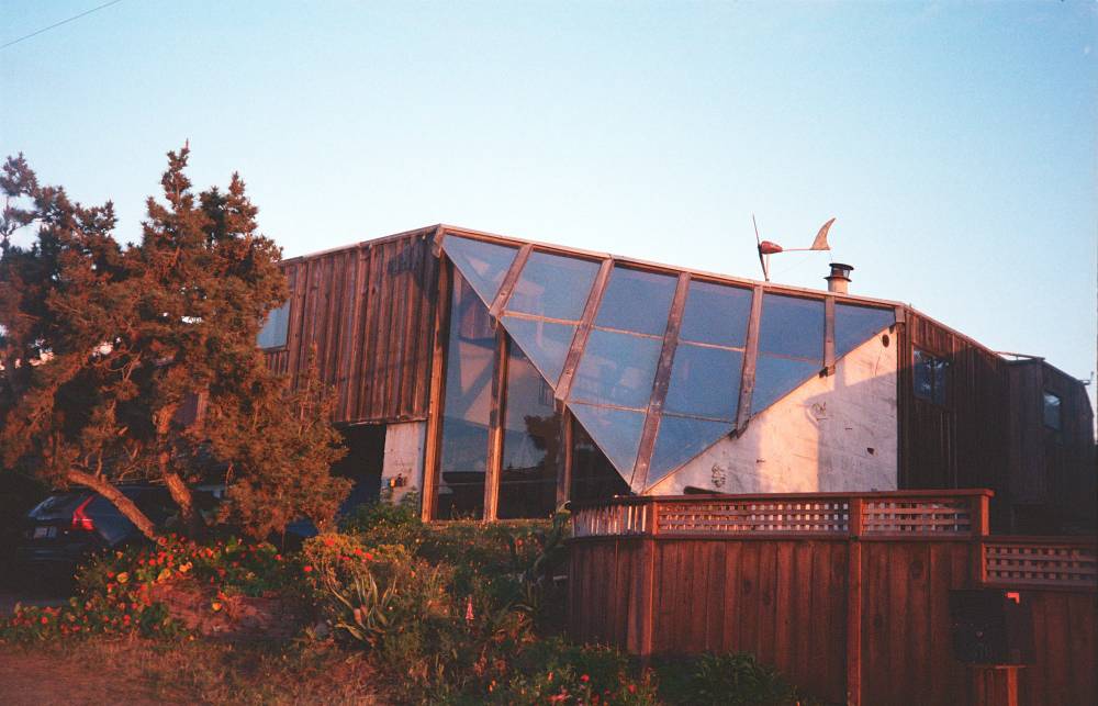 A glass-faceted corner of a wooden home