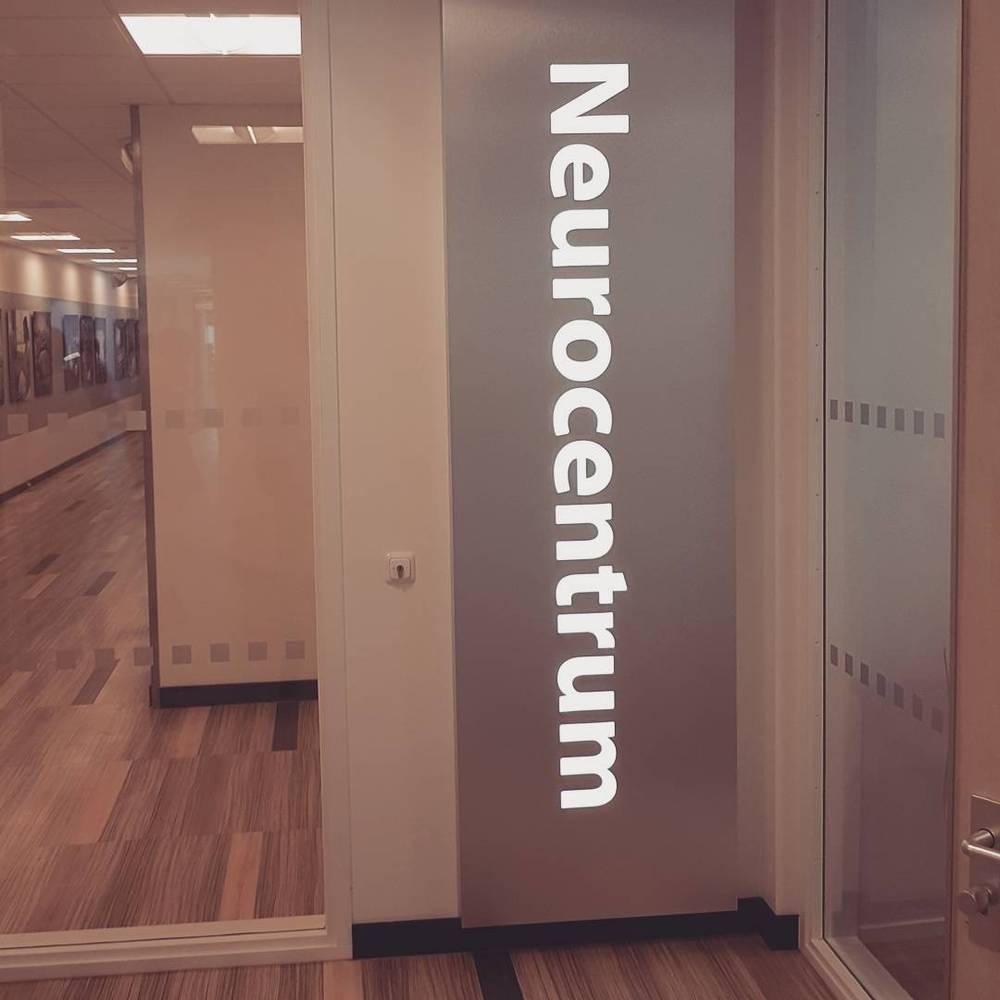 A glass office door labeled "Neurocentrum."
