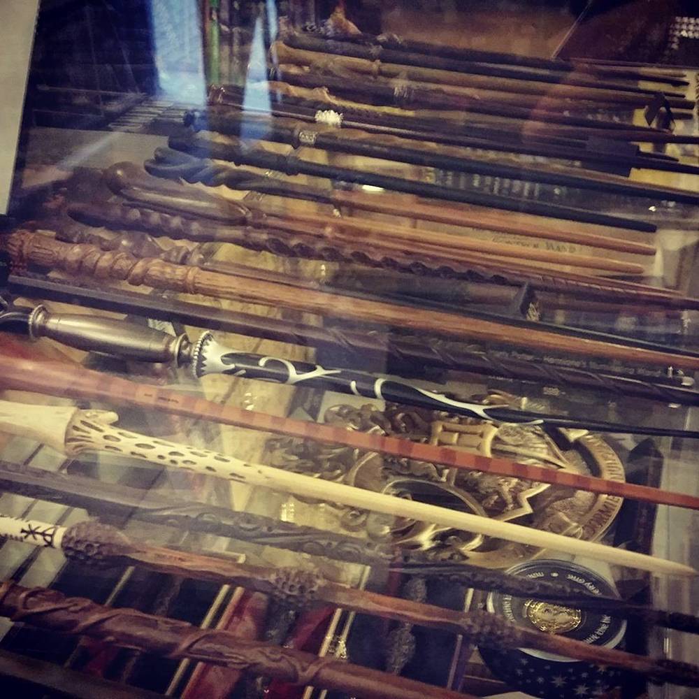A display case filled with antique swords and sabers.