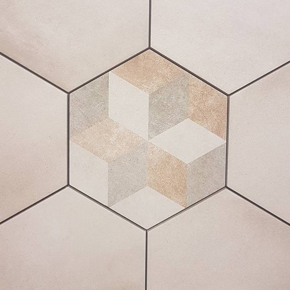 A hexagon-patterned tile floor with a subtle geometric cube design.