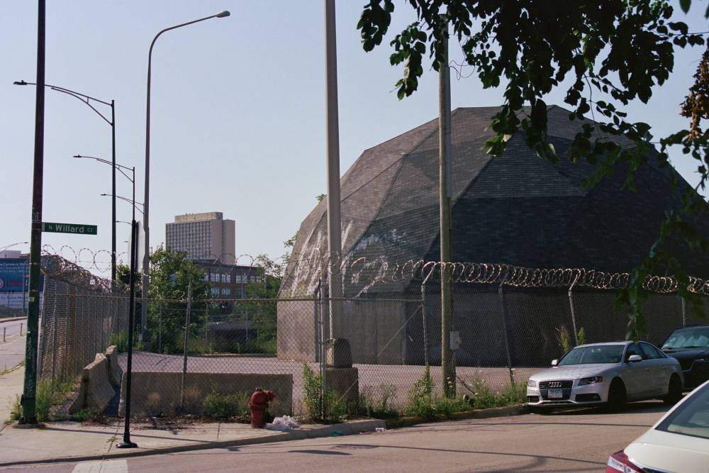 Weird building I saw on Wilford Court and Milwaukee Ave that looks like a low polygon half sphere. It’s behind a chain link fence with curled barbed wire on top