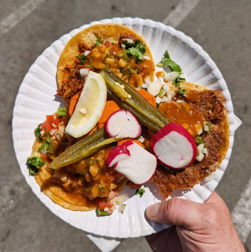 3 tacos on a paper plate
