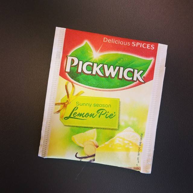 A packet of Pickwick 'Lemon Pie' flavored tea against a dark surface.
