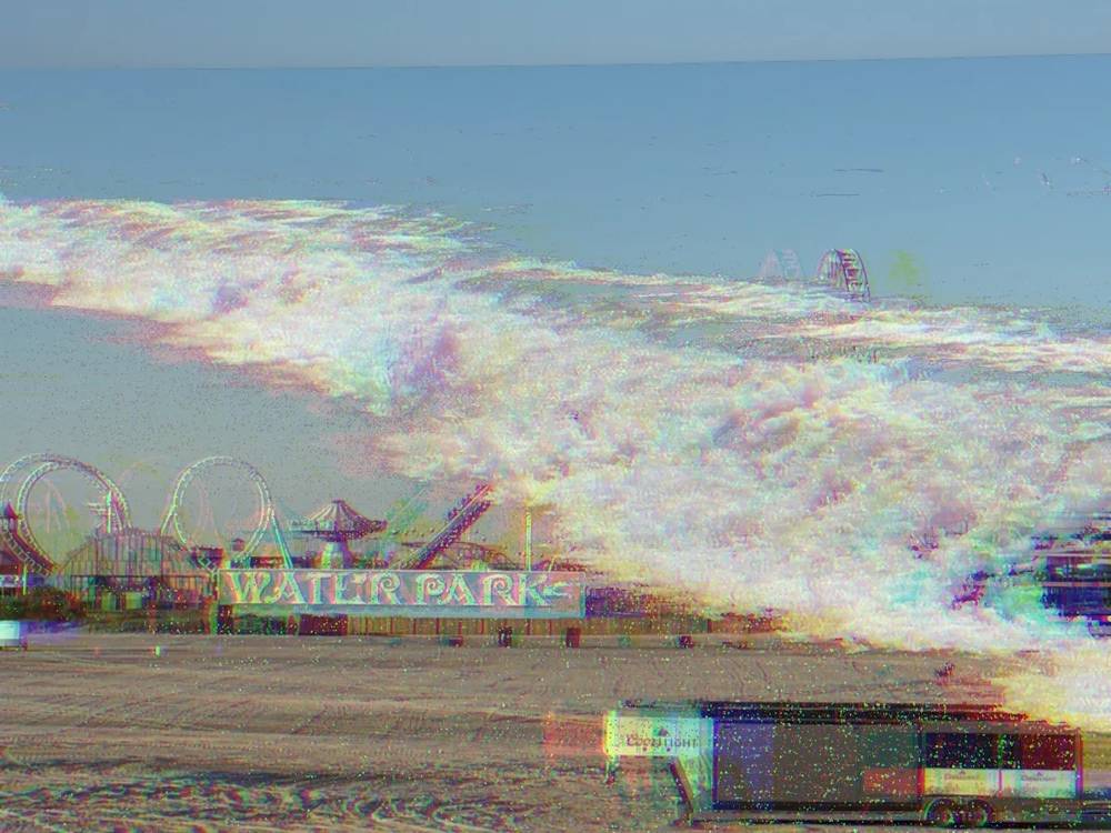 a digital collage of a wave against a photograph of the Wildwood, NJ boardwalk, digitally downsampled and a mild RGB split