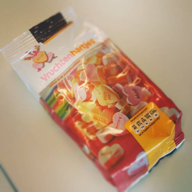 A bag of fruit-flavored heart-shaped candies labeled 'Vruchtenhartjes'.