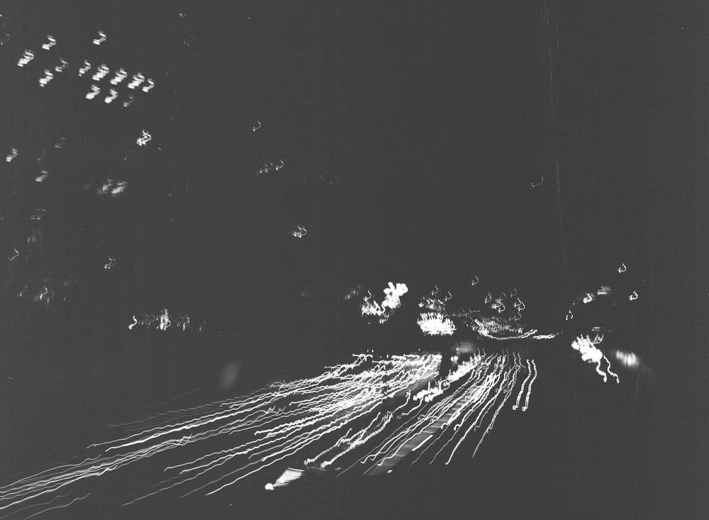 Cars scratch across the ground from the interstate