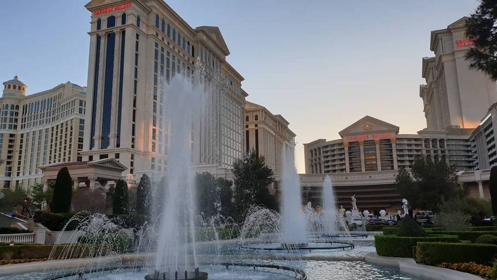 The fountains outside Caesars Palace at dusk in Las Vegas.