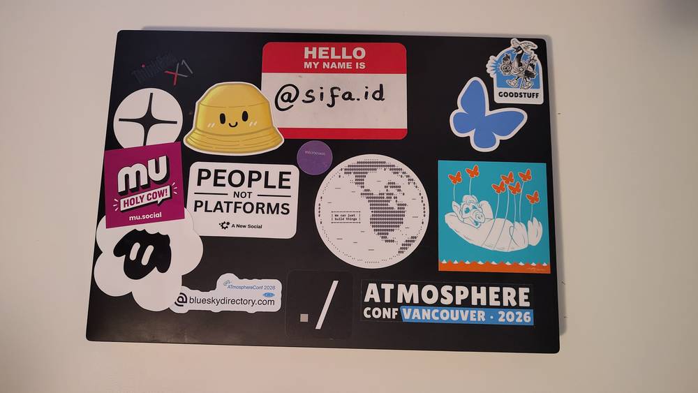 Guido's laptop with atmosphere stickers, including Eurosky, Mu and Tangled