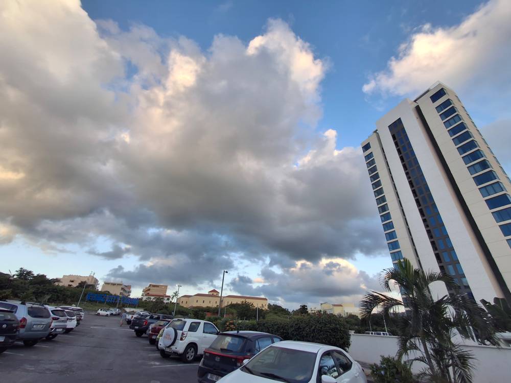 2 buildings with blue skies - parking lot
